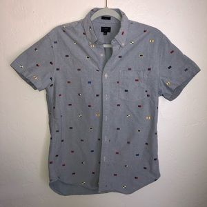 J. Crew button up shirt. Size medium slim fit. Light blue with flag pattern.
